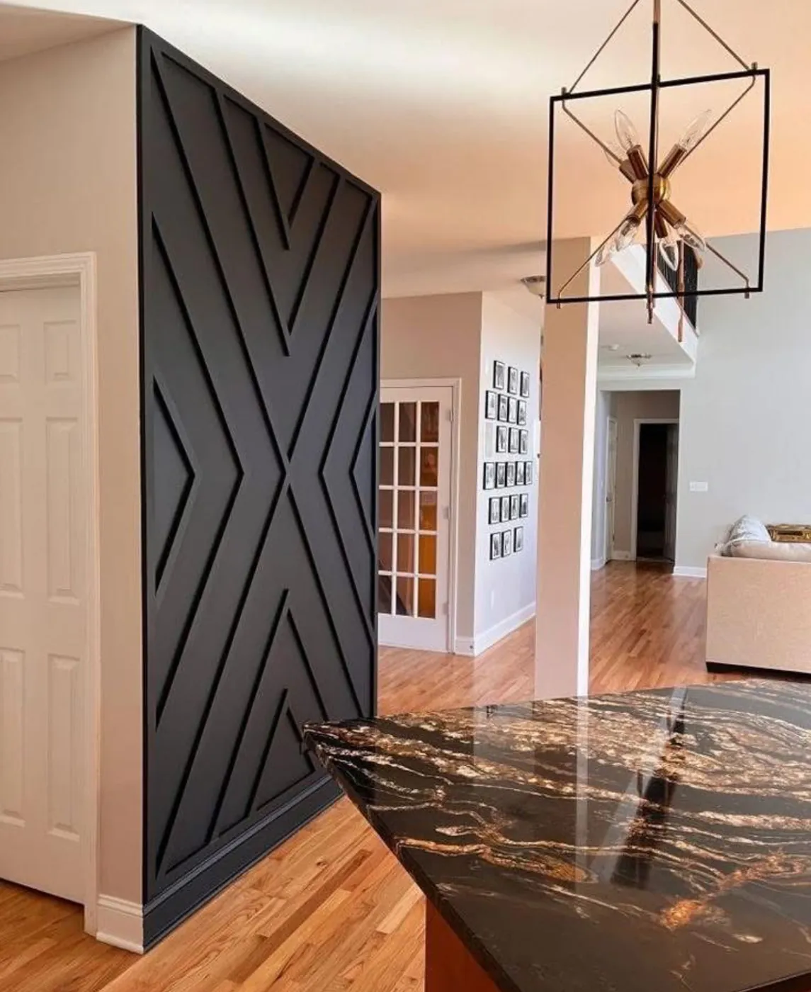 Custom black chevron feature wall with millwork trim