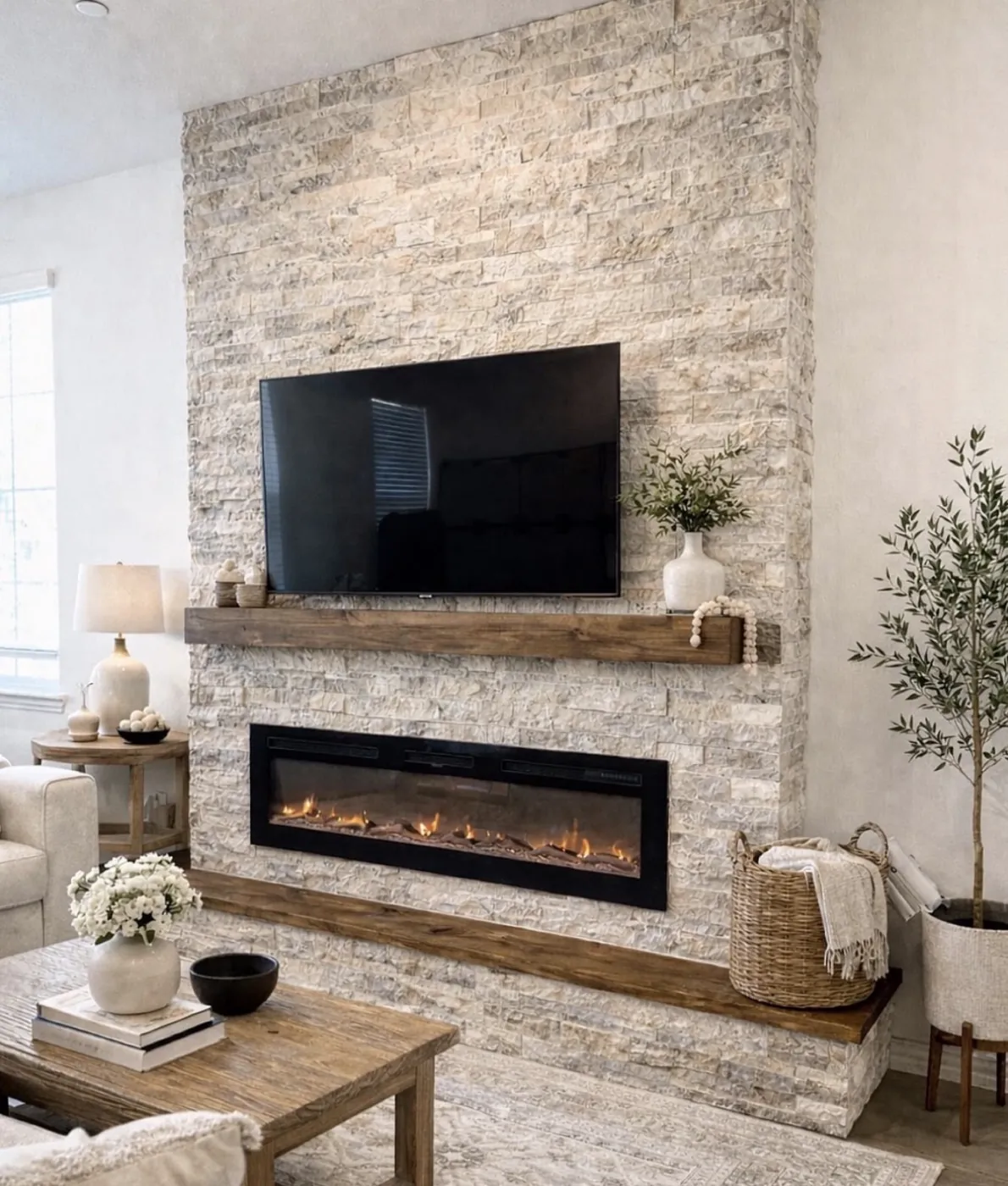 Floor-to-ceiling stone fireplace and media wall with a cedar mantel